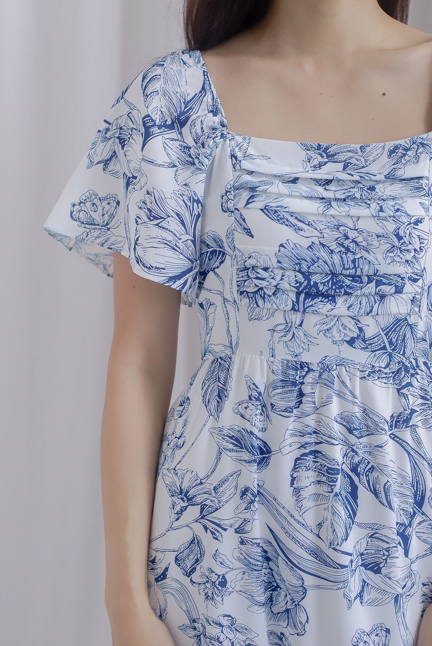Bevelia Flutter Sleeve Pleated Maxi Dress In Navy Chinoiserie The Design Closets Bevelia Flutter Sleeve Pleated Maxi Dress In Navy Chinoiserie The Design Closets