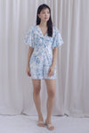 Daria Puffy Sleeve Twist Knot Romper In Blue Porcelain