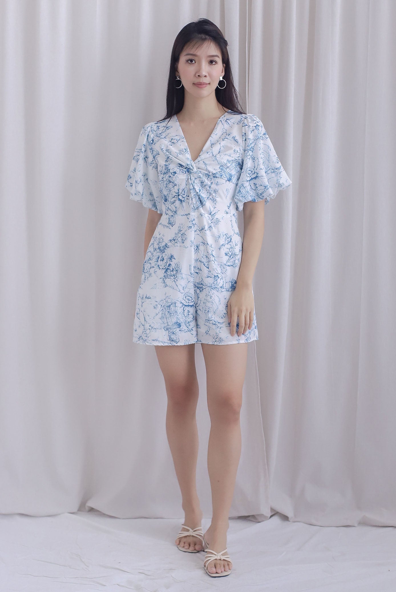 Daria Puffy Sleeve Twist Knot Romper In Blue Porcelain