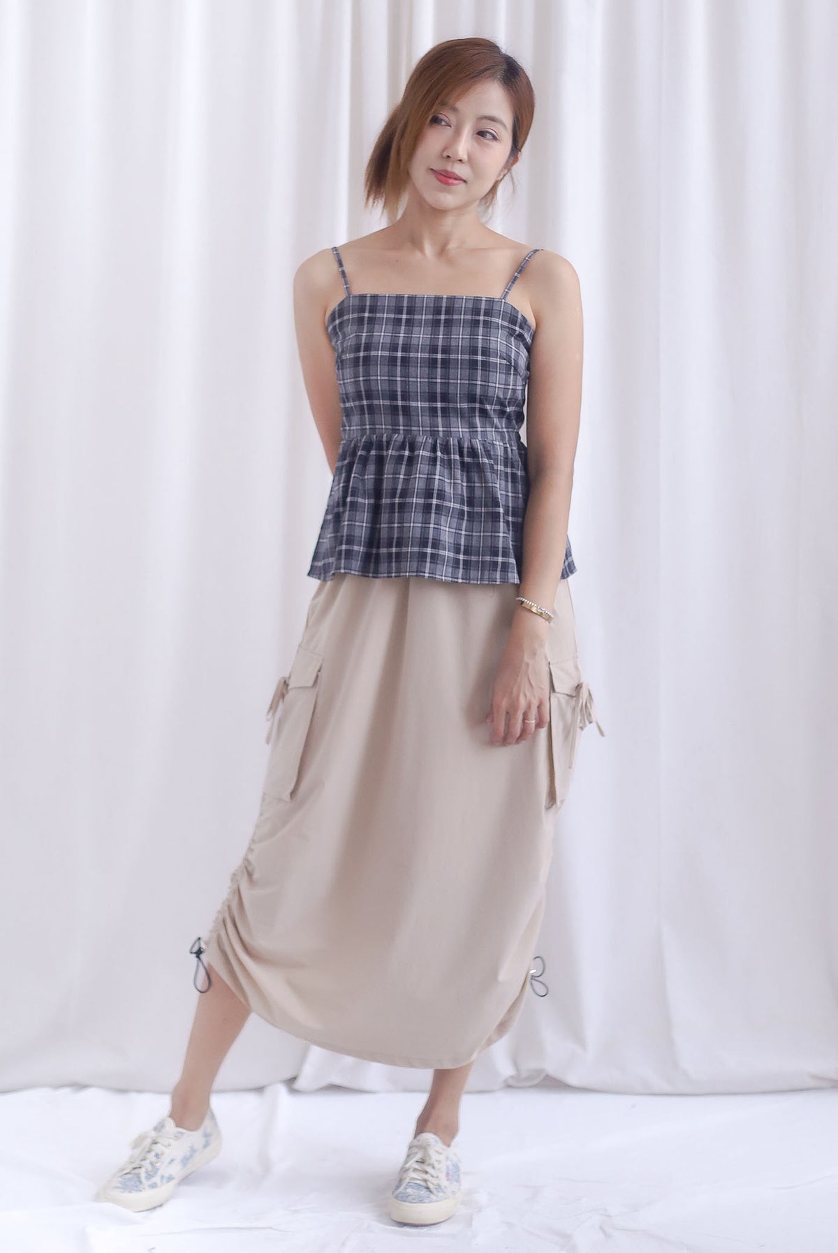 Elly Plaids Spag Peplum Top In Black