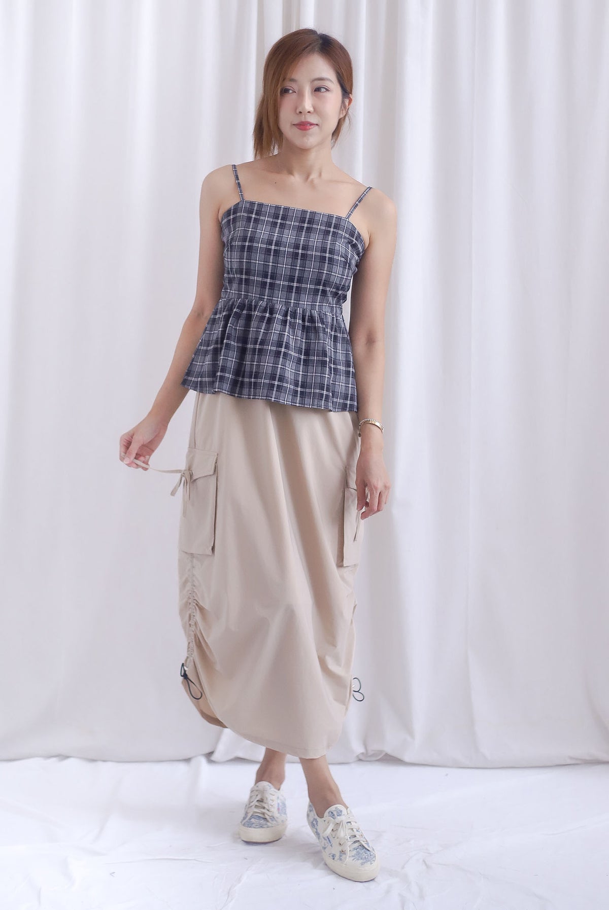 Elly Plaids Spag Peplum Top In Black