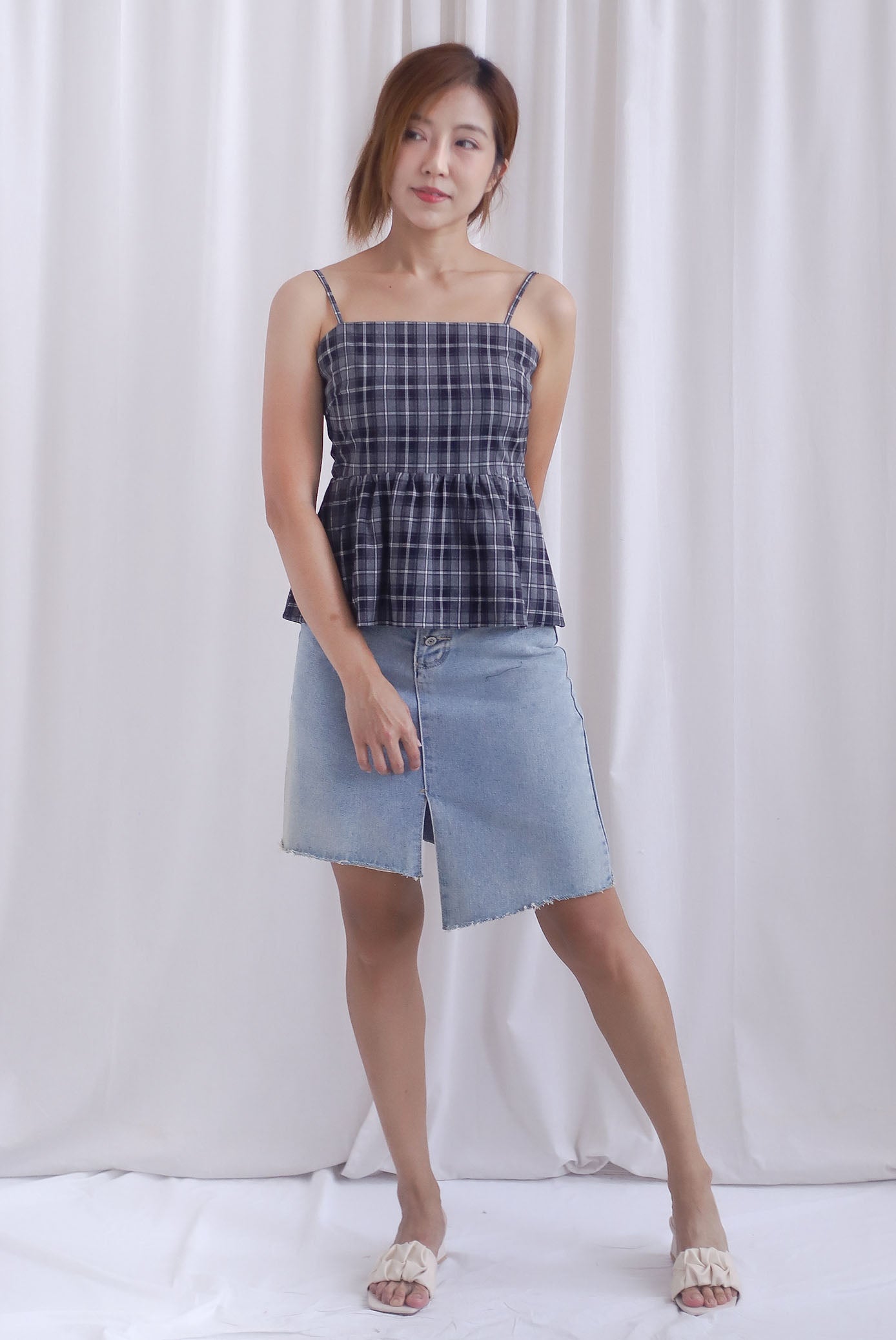 Elly Plaids Spag Peplum Top In Black