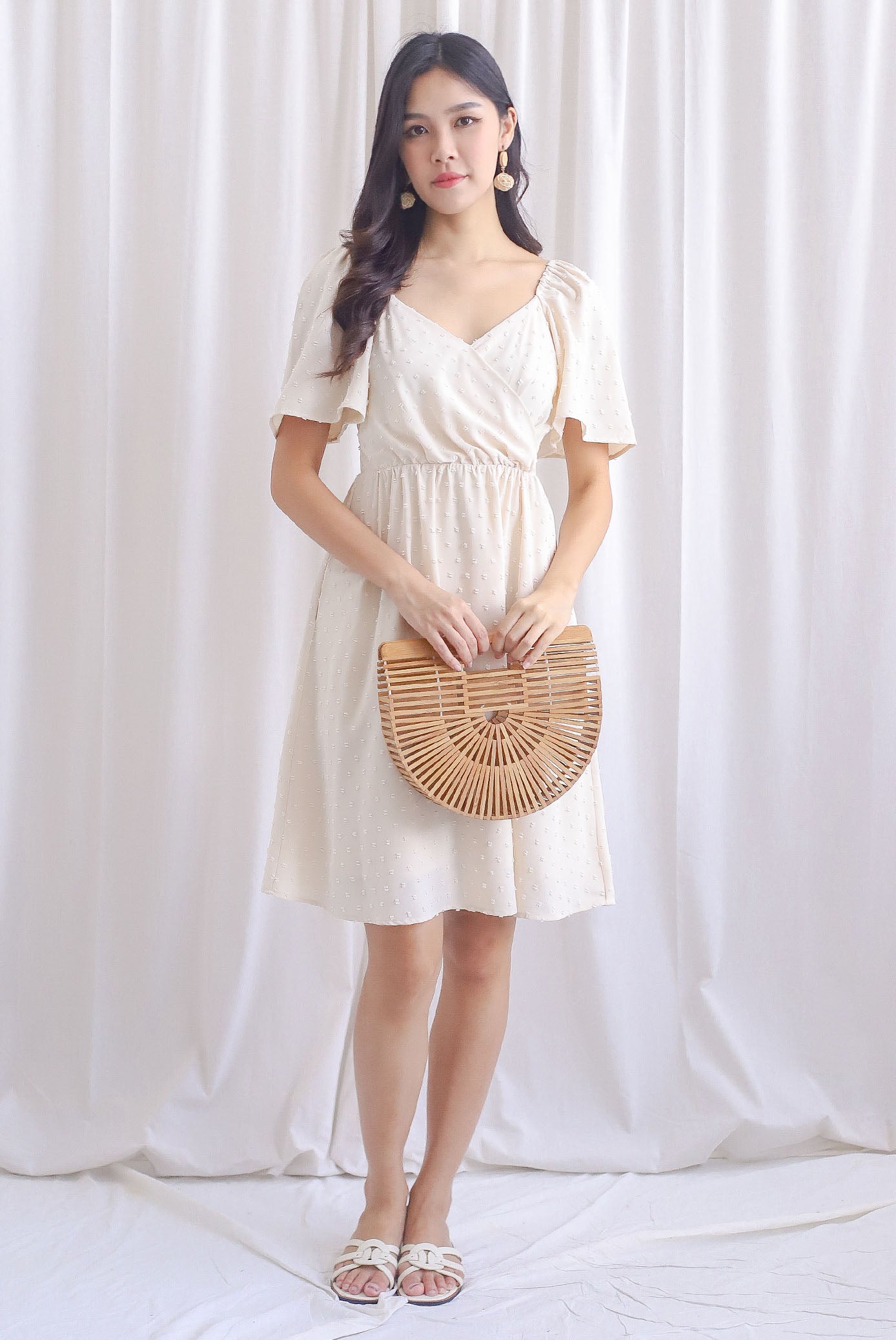 Elly Swiss Dot Flutter Sleeve Dress In Cream – The Design Closets