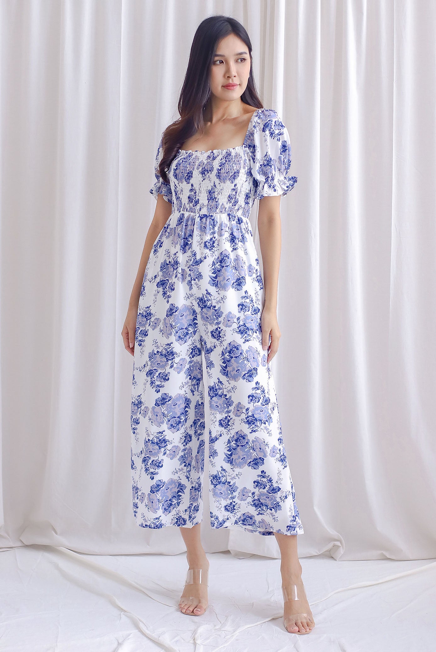 Emmalyn Floral Puffy Sleeve Smocked Jumpsuit In Purplish Blue