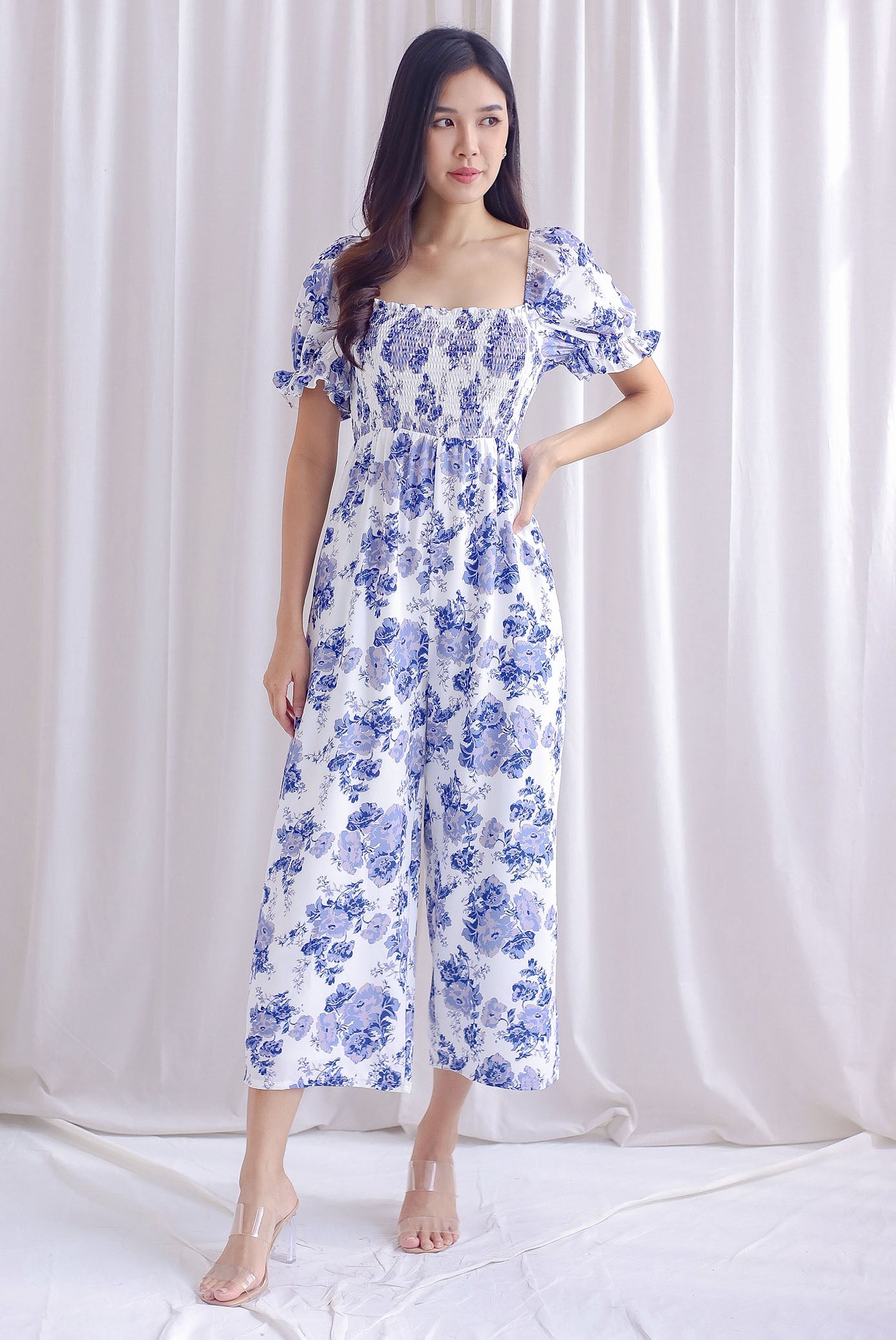 Emmalyn Floral Puffy Sleeve Smocked Jumpsuit In Purplish Blue