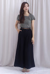 Jevon Wide Legged Pleated Palazzo Pants In Black