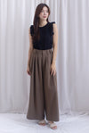 Jevon Wide Legged Pleated Palazzo Pants In Mocha