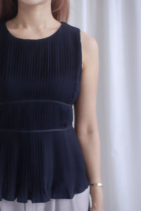 Meret Pleated Peplum Top In Black