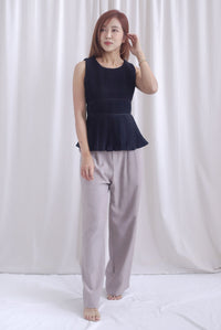 Meret Pleated Peplum Top In Black