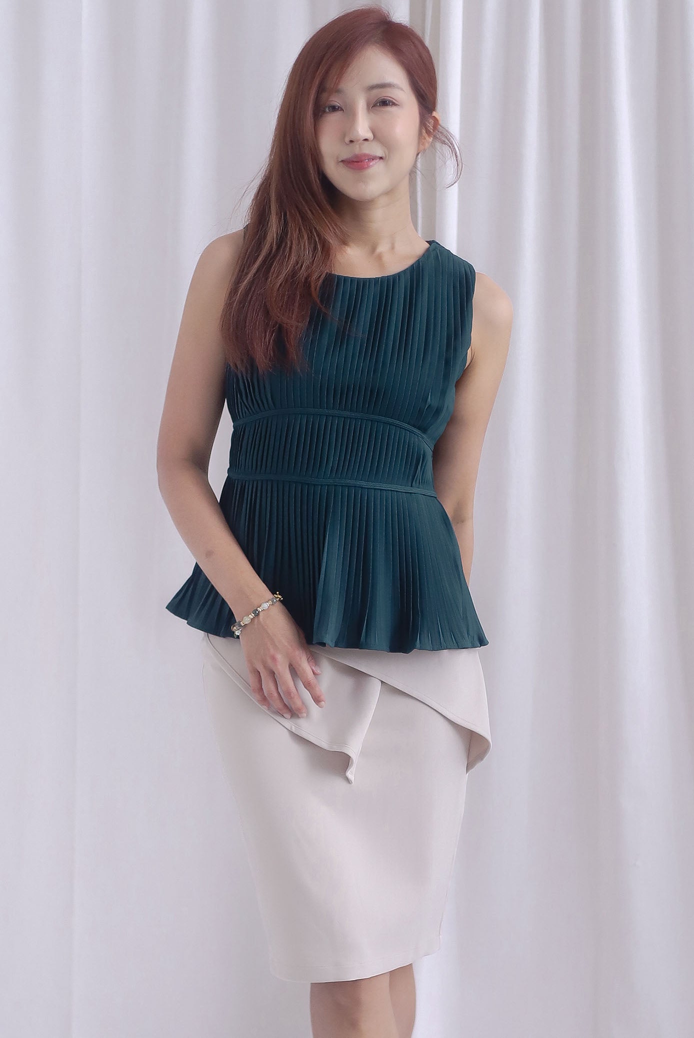 Meret Pleated Peplum Top In Forest Green