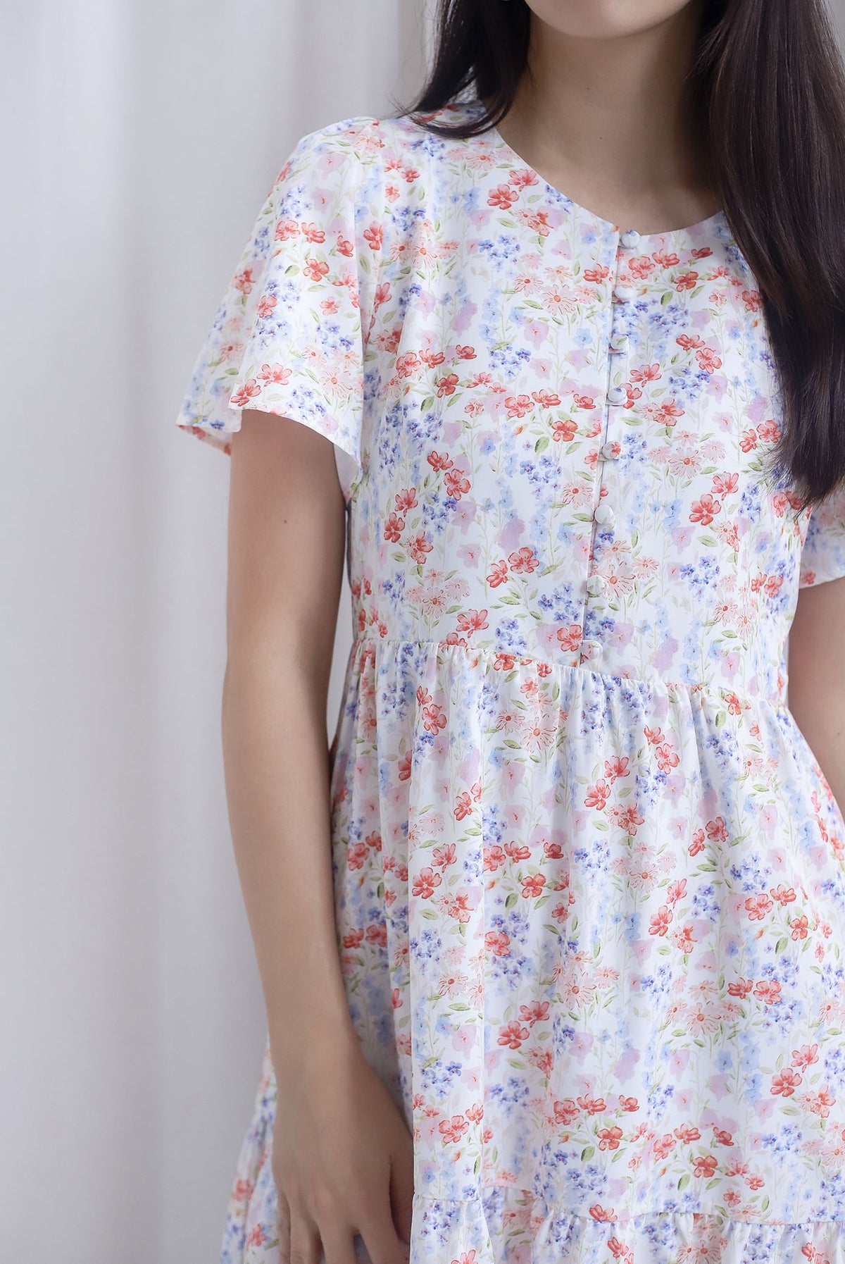 Oralie Flutter Sleeve Buttons Babydoll Dress In Orange Floral