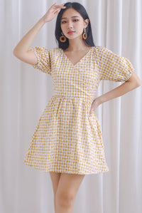 Evvie Gingham Embro Faux Wrap Romper In Yellow