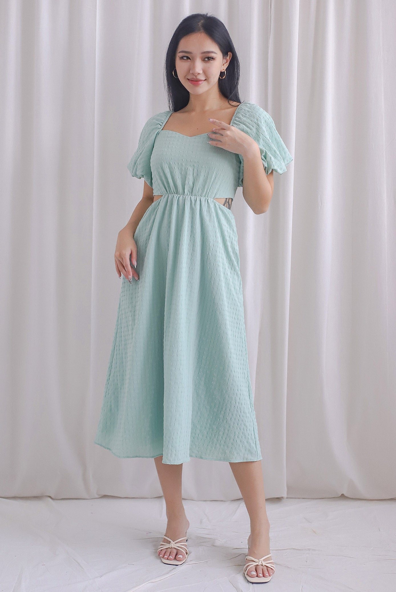 Hebe Puffy Sleeve Side Cut Out Dress In Seafoam The Design Closets Hebe puffy sleeve side cut out dress in seafoam the design closets