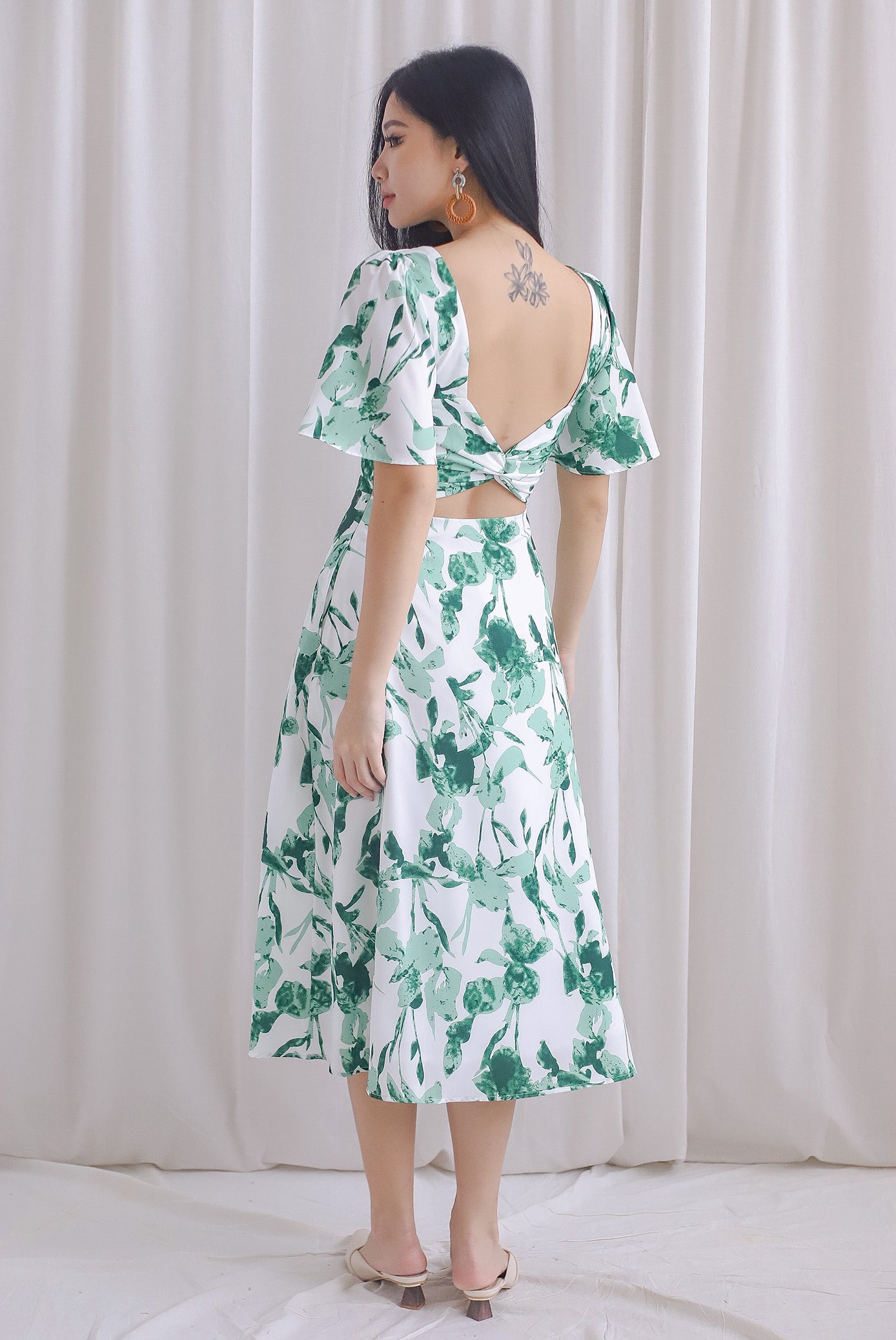 Izzy Leafy Padded Twist Back Midi Dress In Green The Design Closets Izzy Leafy Padded Twist Back Midi Dress In Green The Design Closets