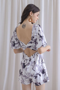 Poppie Puffy Sleeve Bow Back Romper In Mono Floral