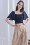 Stephi Flutter Sleeve Smocked Top In Black