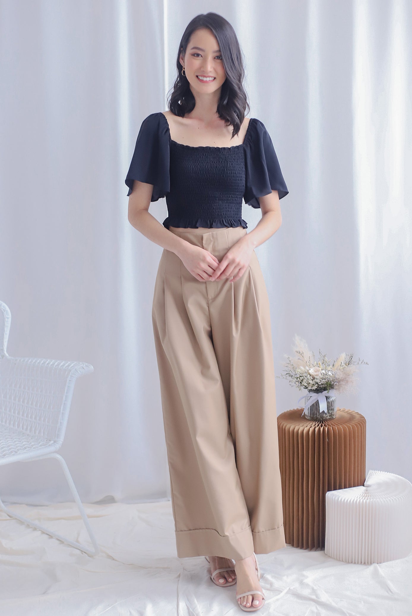 Stephi Flutter Sleeve Smocked Top In Black