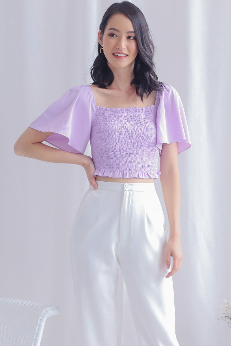 Stephi Flutter Sleeve Smocked Top In Lilac